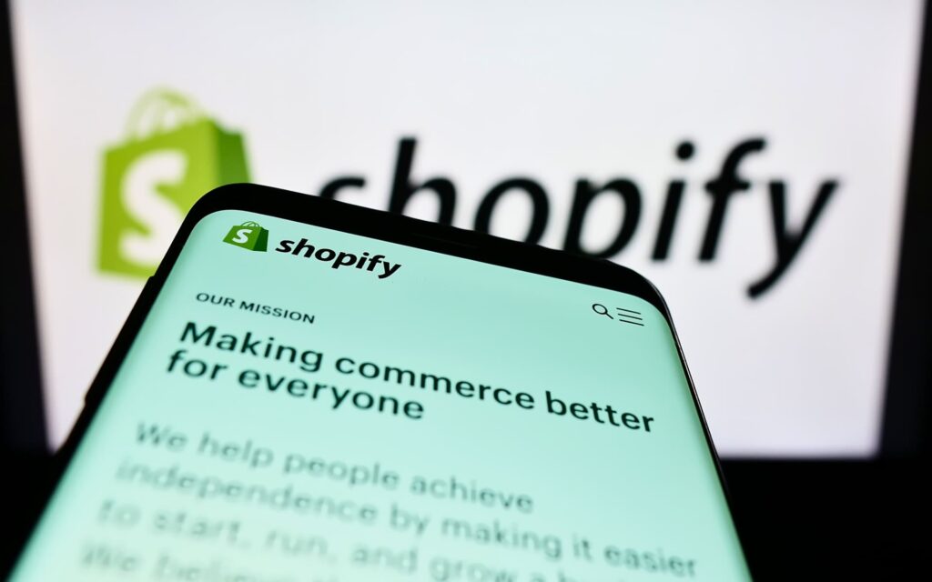 Phone with Shopify mission statement | Shopify’s North Star metric