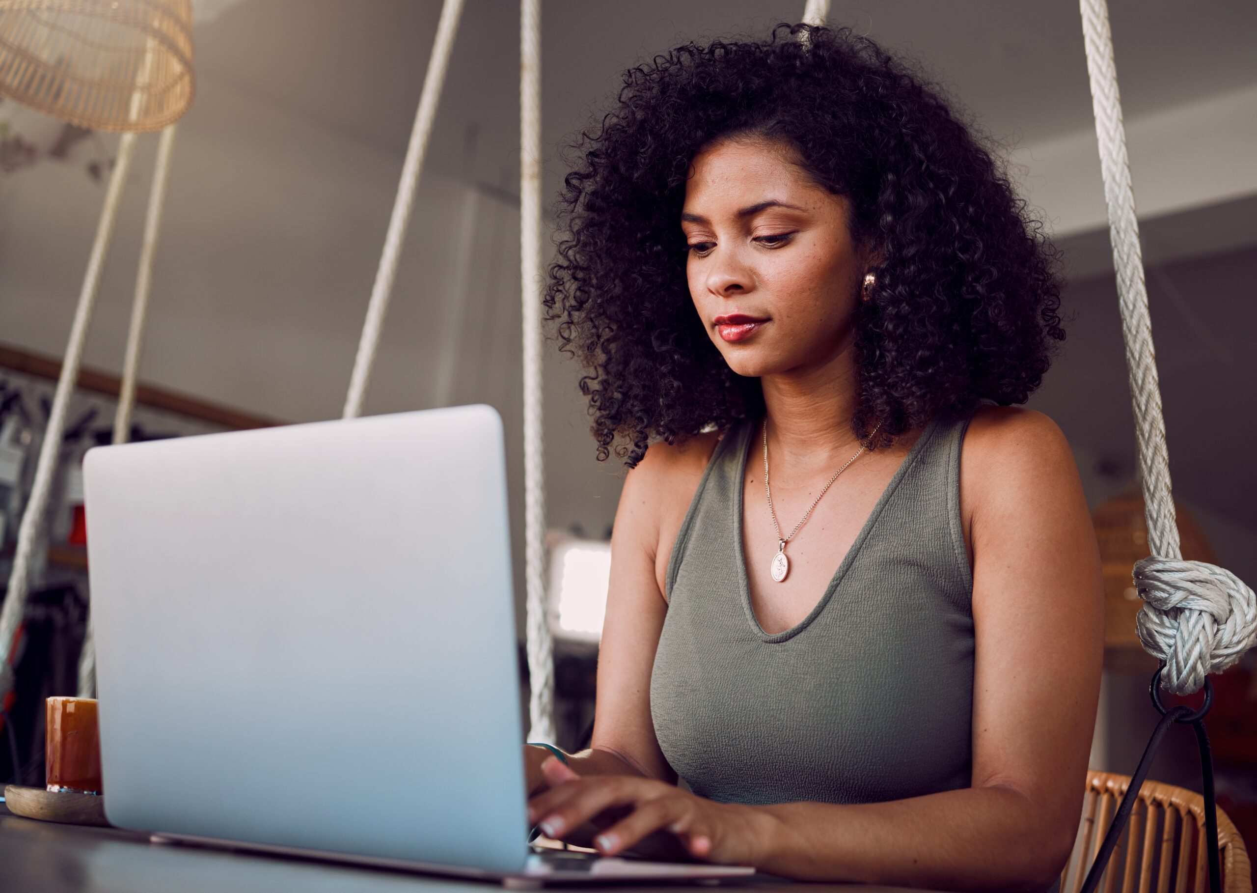 Woman optimizing a content piece on a laptop | Teknicks